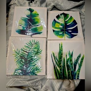 Set of 4 new sealed plant themed canvases. 12x12 each